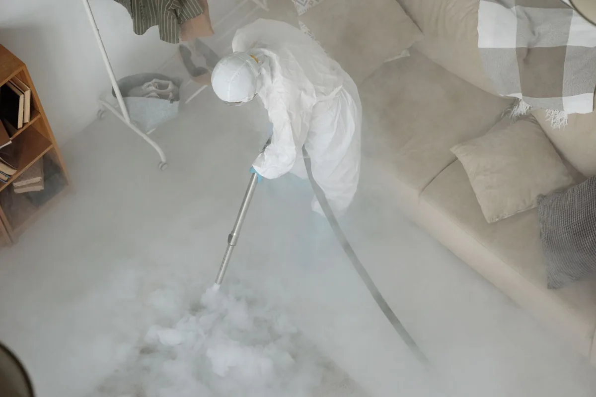 Biohazard cleanup technician in protective equipment, Wichita Falls, TX